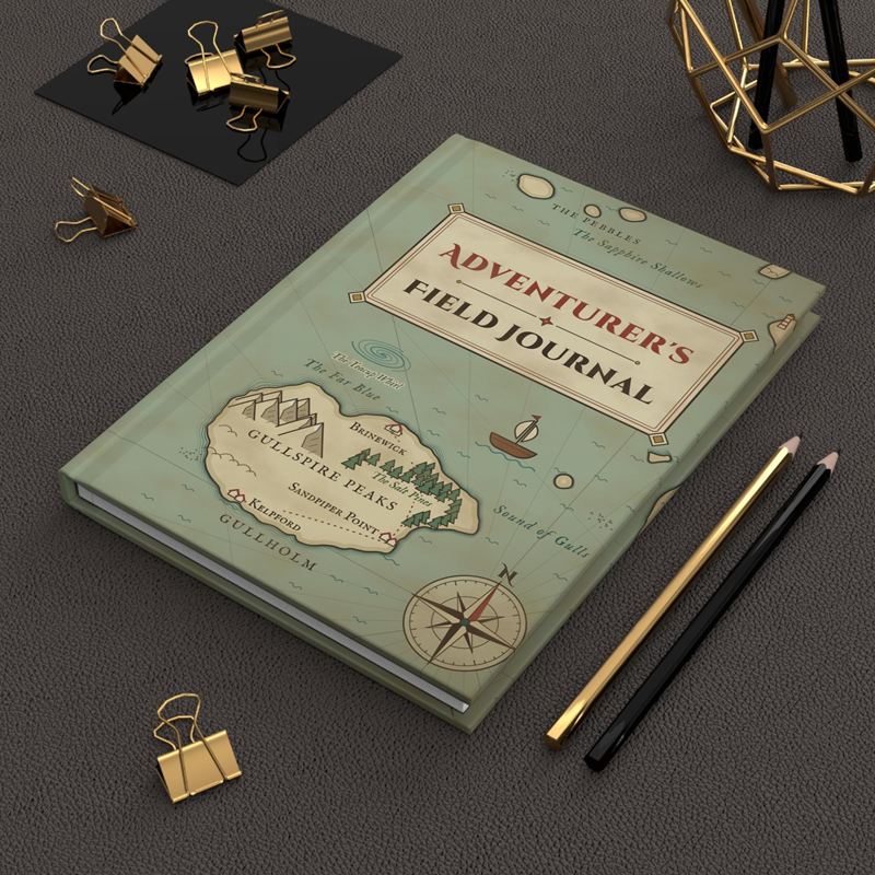 Sage-green hardcover journal with a sea chart island, a compass rose and the title Adventurer's Field Journal