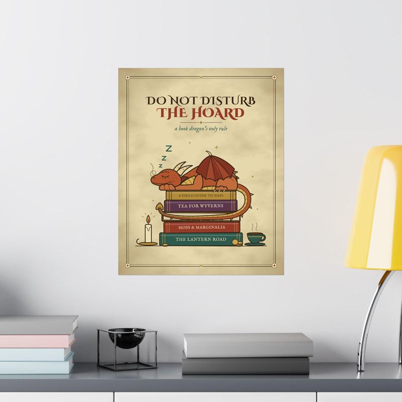 Book dragon print of a copper dragon asleep on a stack of books under Do Not Disturb the Hoard, on a white wall