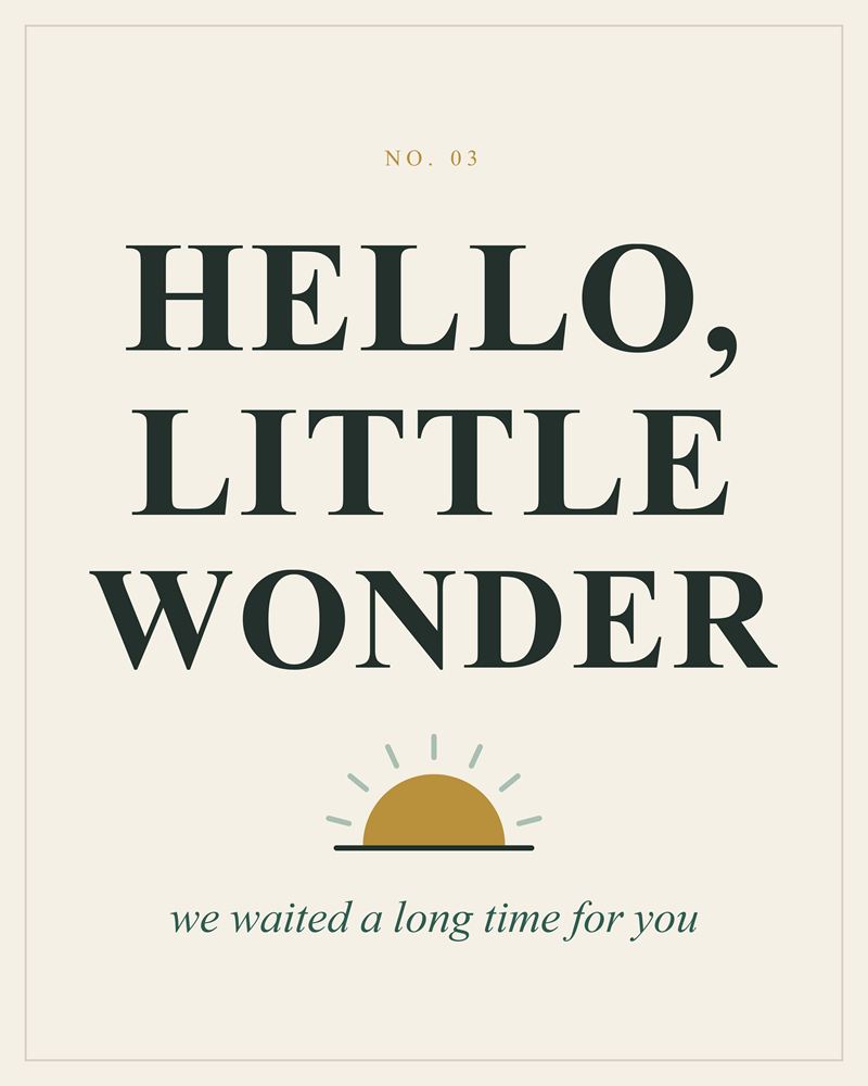 Full design of the Hello, Little Wonder print: dark green serif capitals over a gold rising sun with sage rays