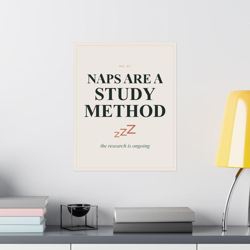 Cream poster reading Naps Are a Study Method with three terracotta Zs, on a white wall beside a yellow lamp