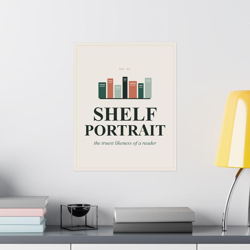 Cream poster with a row of colorful book spines above Shelf Portrait, on a white wall beside a yellow lamp